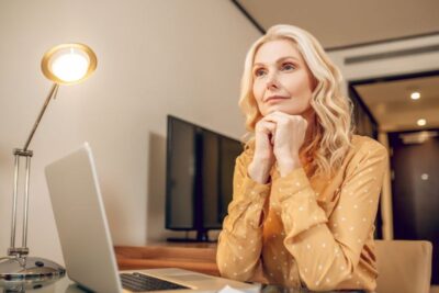 blonde stylish businesswoman working at the laptop